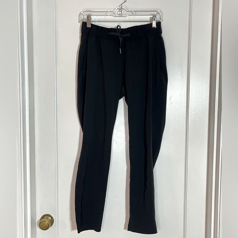 Lululemon On The Fly Pant *Woven 27" Elastic Waist Side Pockets black size 4